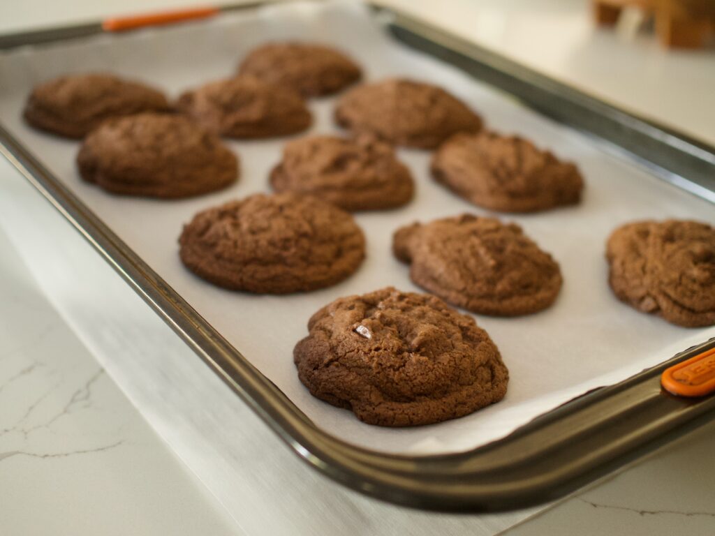 baked double chocolate cookies on sheet