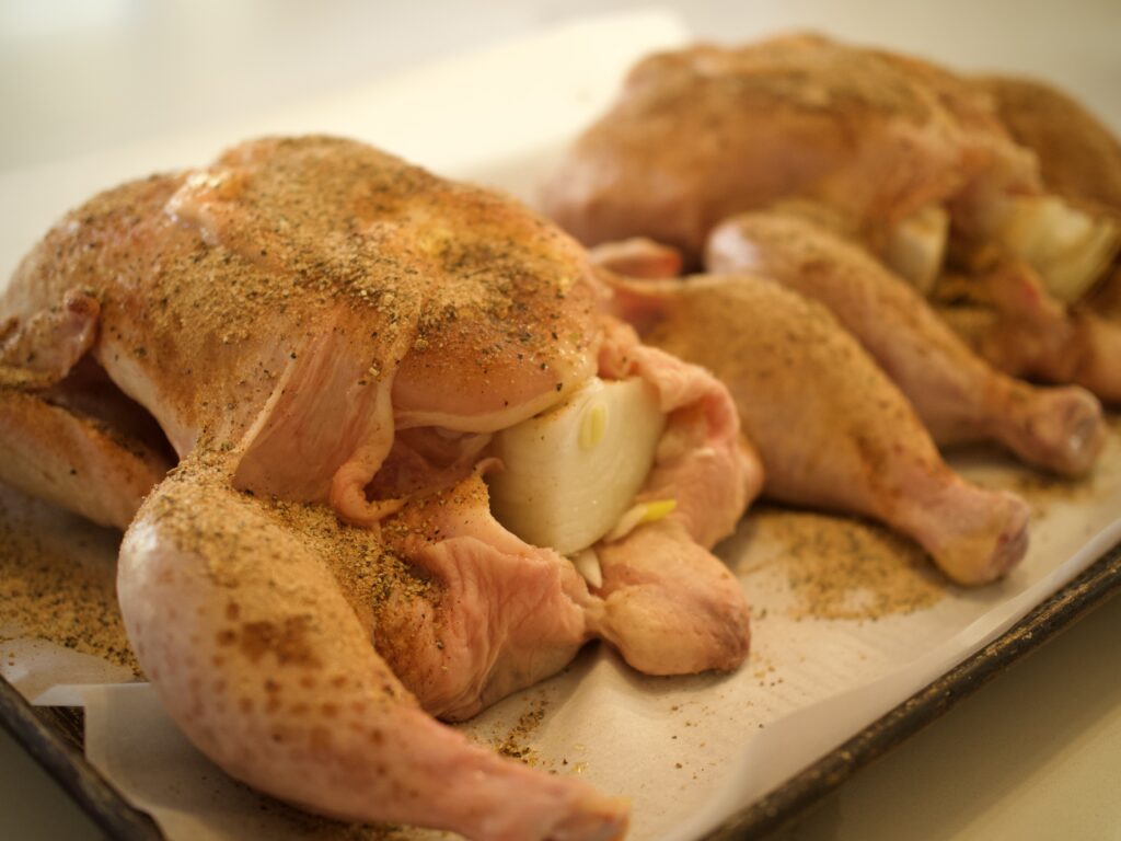 Smoker chickens prepped with seasoning