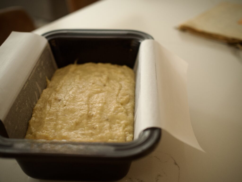 Banana bread batter in loaf pan