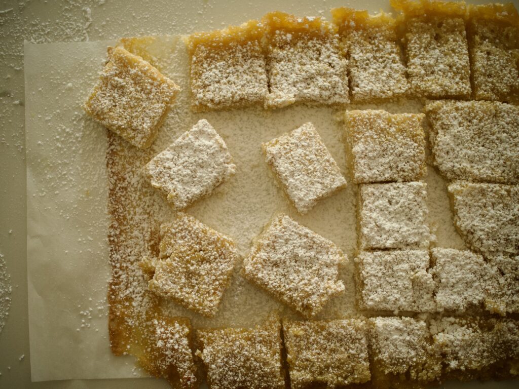 finished lemon bars dusted with powdered sugar